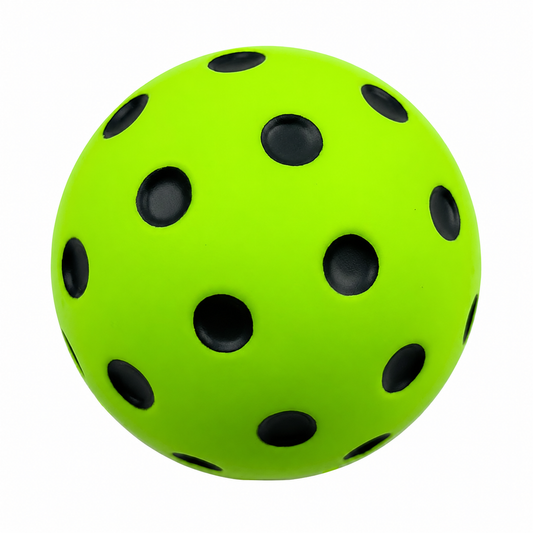 Balle de pickleball en mousse amortissante vert fluo pour une pratique totalement silencieuse en salle.