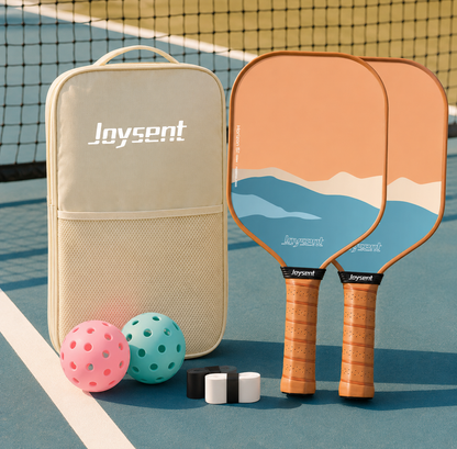 Set de pickleball pack duo Horizon marron et orange avec deux raquettes au design paysage, sac et accessoires.