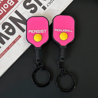 Mini raquette porte-clés rose fuchsia flashy, vue du recto et du verso.