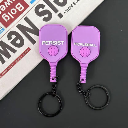Mini raquette porte-clés de couleur violette, vue de face et de dos.
