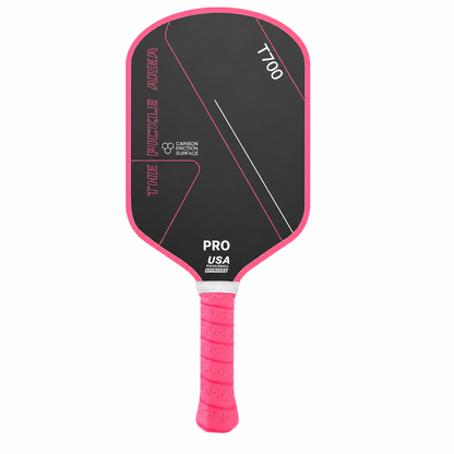 Modèle rose fuchsia de la raquette carbone T700 Pro Area avec un grip perforé assorti.